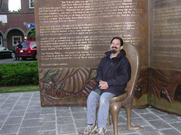 Dean in the Storyteller's Chair with text